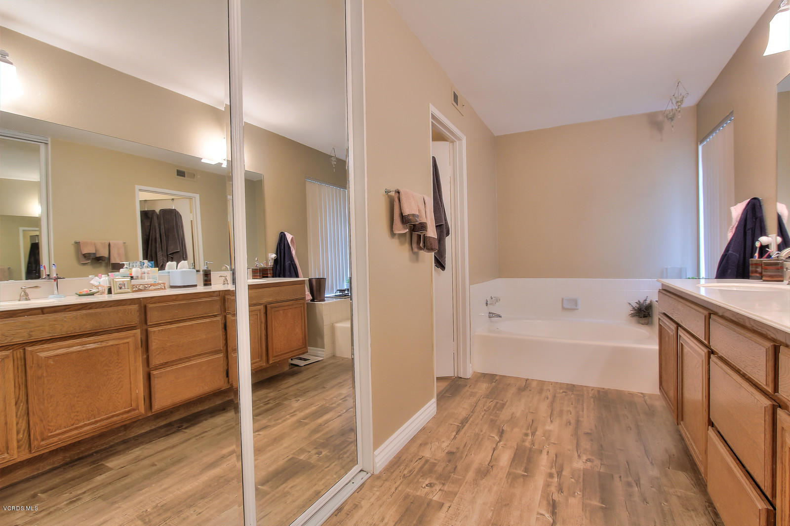 12510 Crystal Ranch Road Moorpark, CA 93021 - Photo 30 of 43 a bathroom with a tub sink and mirror
