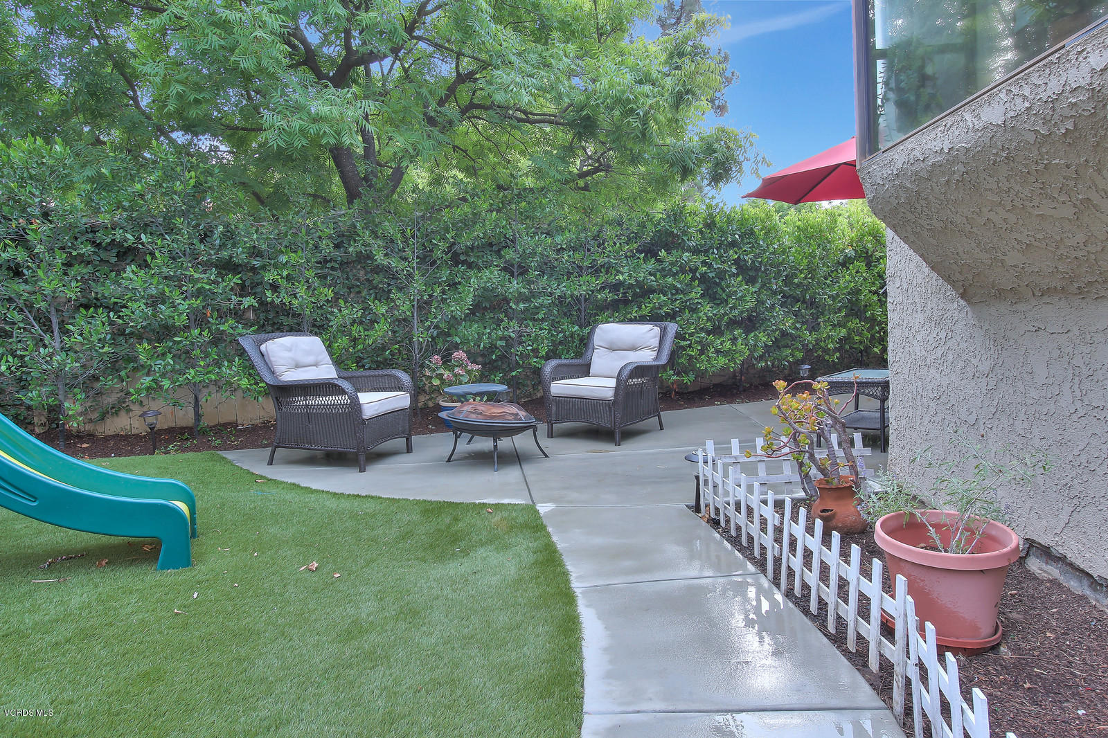 12510 Crystal Ranch Road Moorpark, CA 93021 - Photo 38 of 43 a view of a chairs and table in backyard