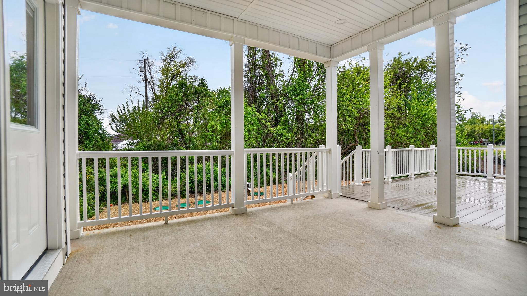 2001 Poplar Ridge Road Pasadena, MD 21122 - Photo 56 of 83 a view of a porch with a floor to ceiling window and garden