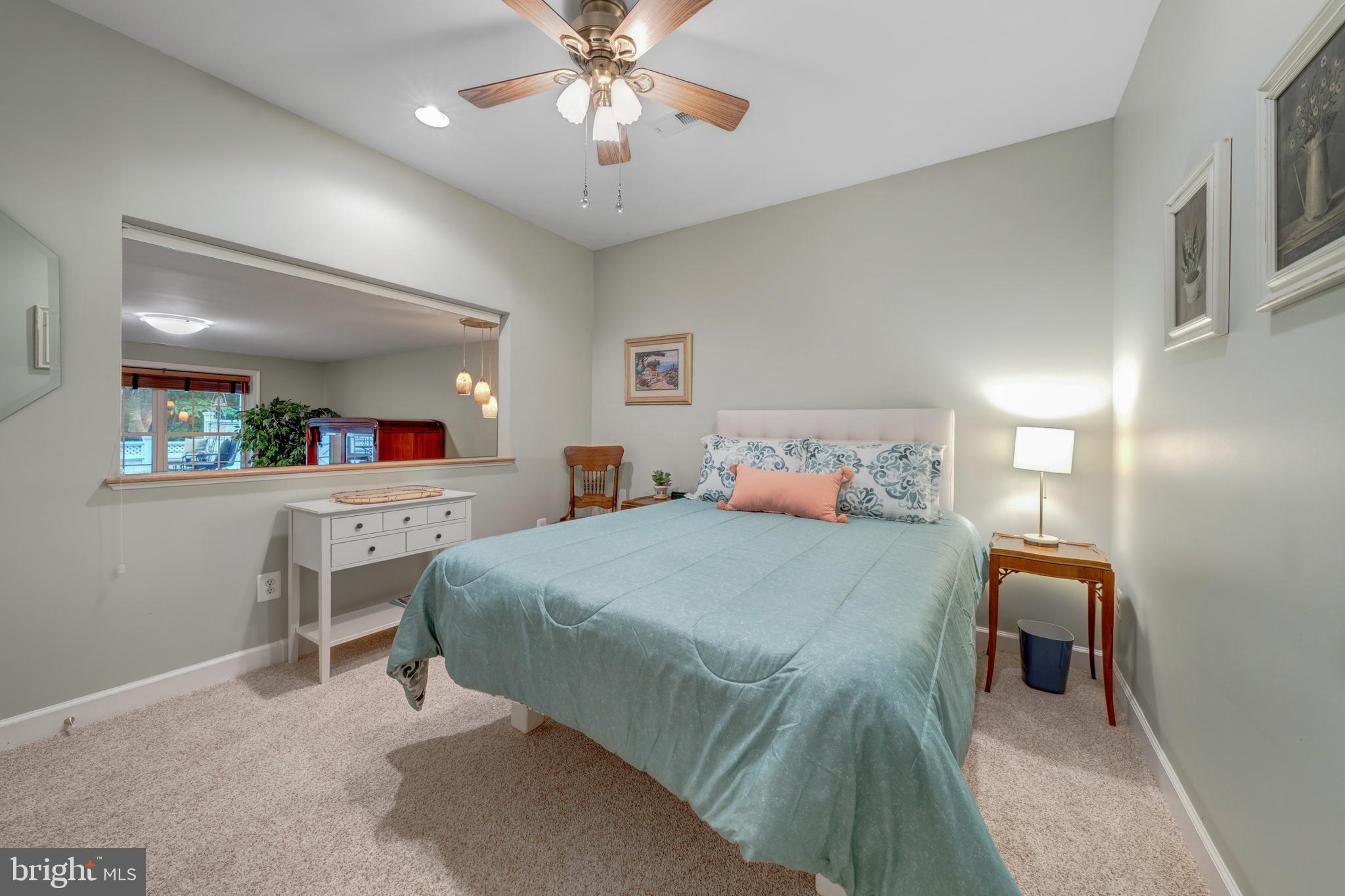 1925 Logan Manor Drive Reston, VA 20190 - Photo 36 of 61 a bedroom with a bed and a chandelier