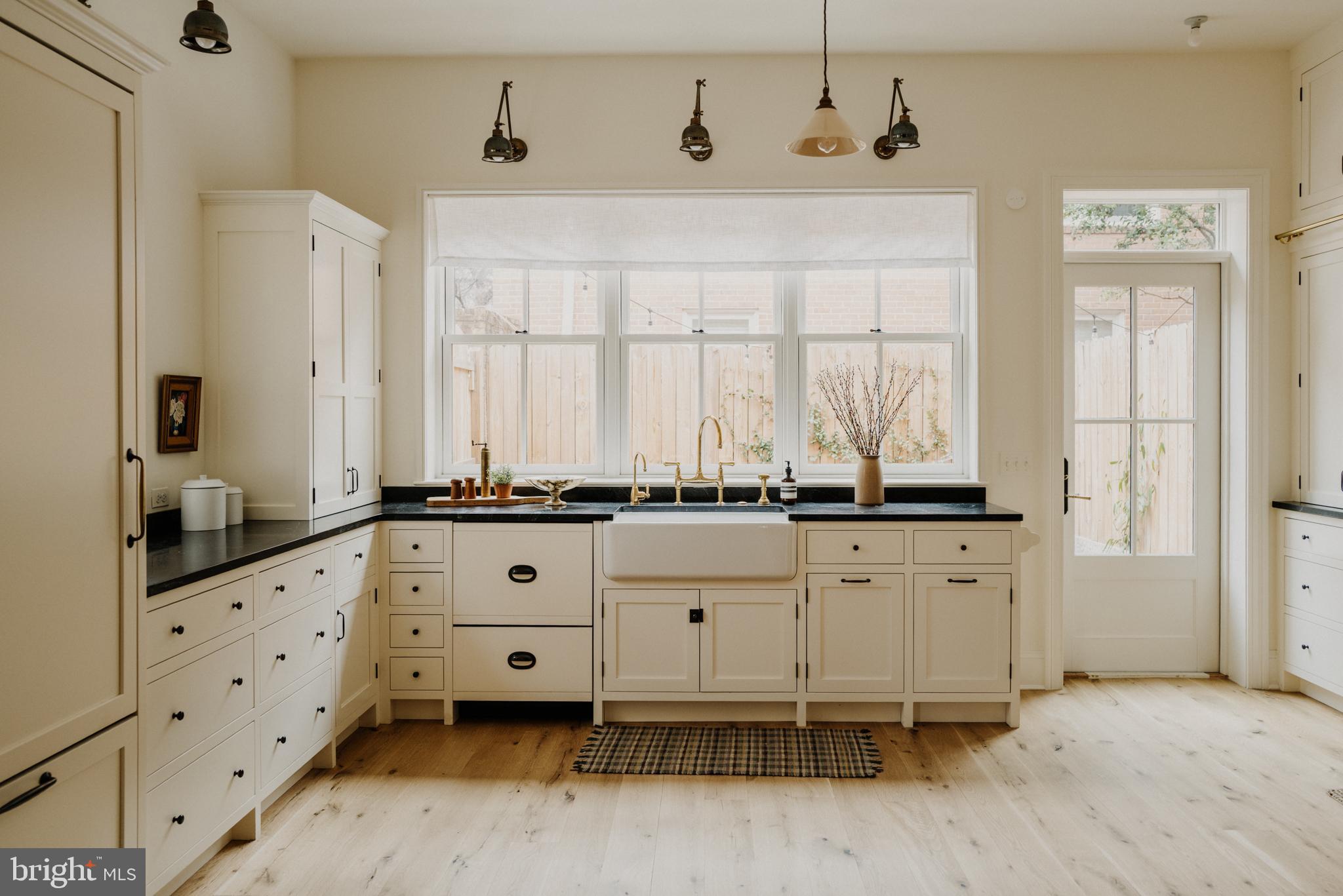 1000 Independence Avenue Southeast Washington, DC 20003 - Photo 2 of 4 a large kitchen with granite countertop a sink and a window