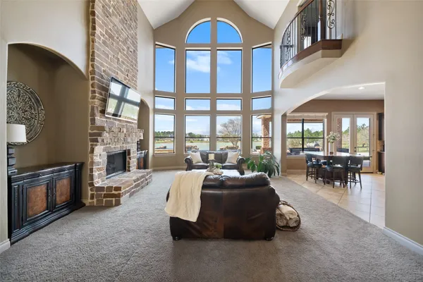 a living room with furniture fireplace and flat screen tv