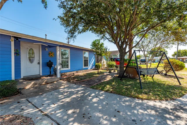 a view of a trees in front of a house