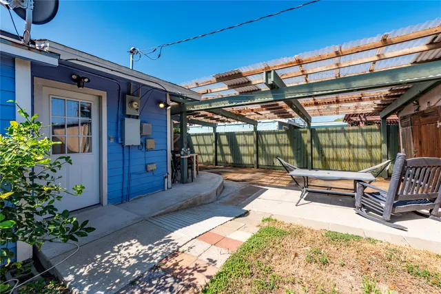 a view of a chairs and table in the patio
