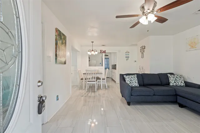 a living room with furniture and a table