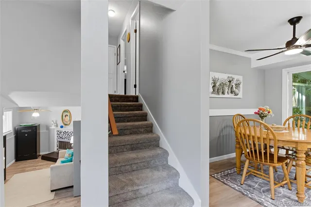 a view of a hallway with furniture and entryway
