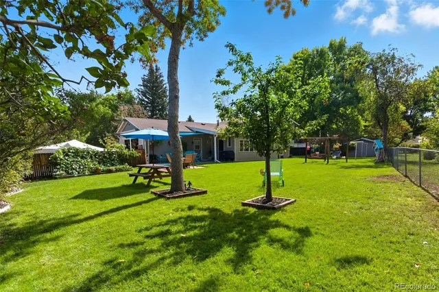 a view of a park with large trees