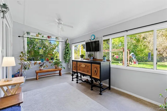 a reading room with furniture and a window