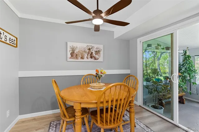 a view of a dining room with furniture and front door