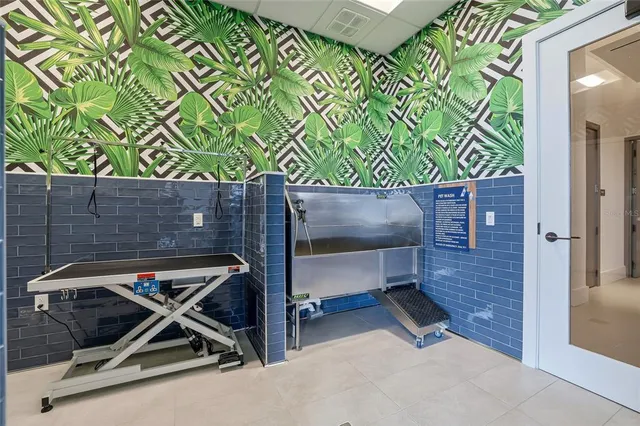 a view of a room with gym equipment and a large window