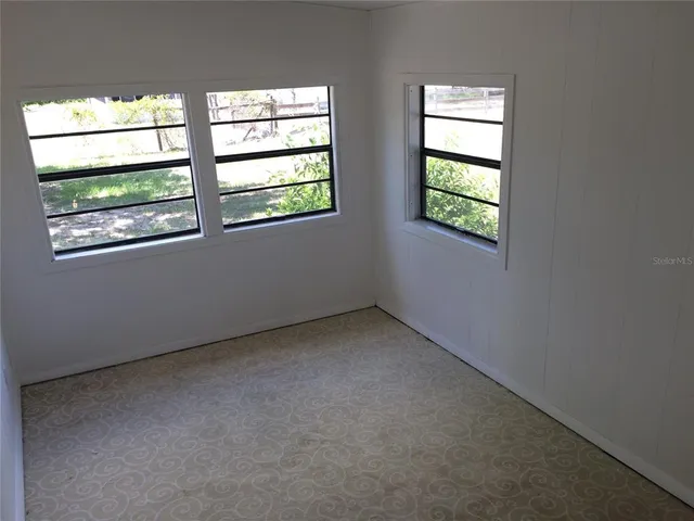 an empty room with windows