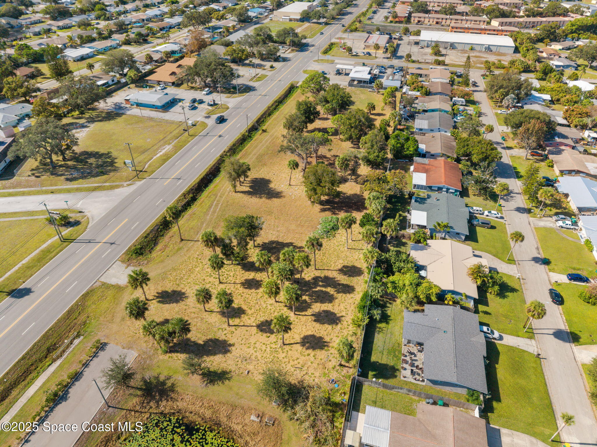 1400 Aurora Road Melbourne, FL 32935 - Photo 11 of 13 an aerial view of residential houses with outdoor space
