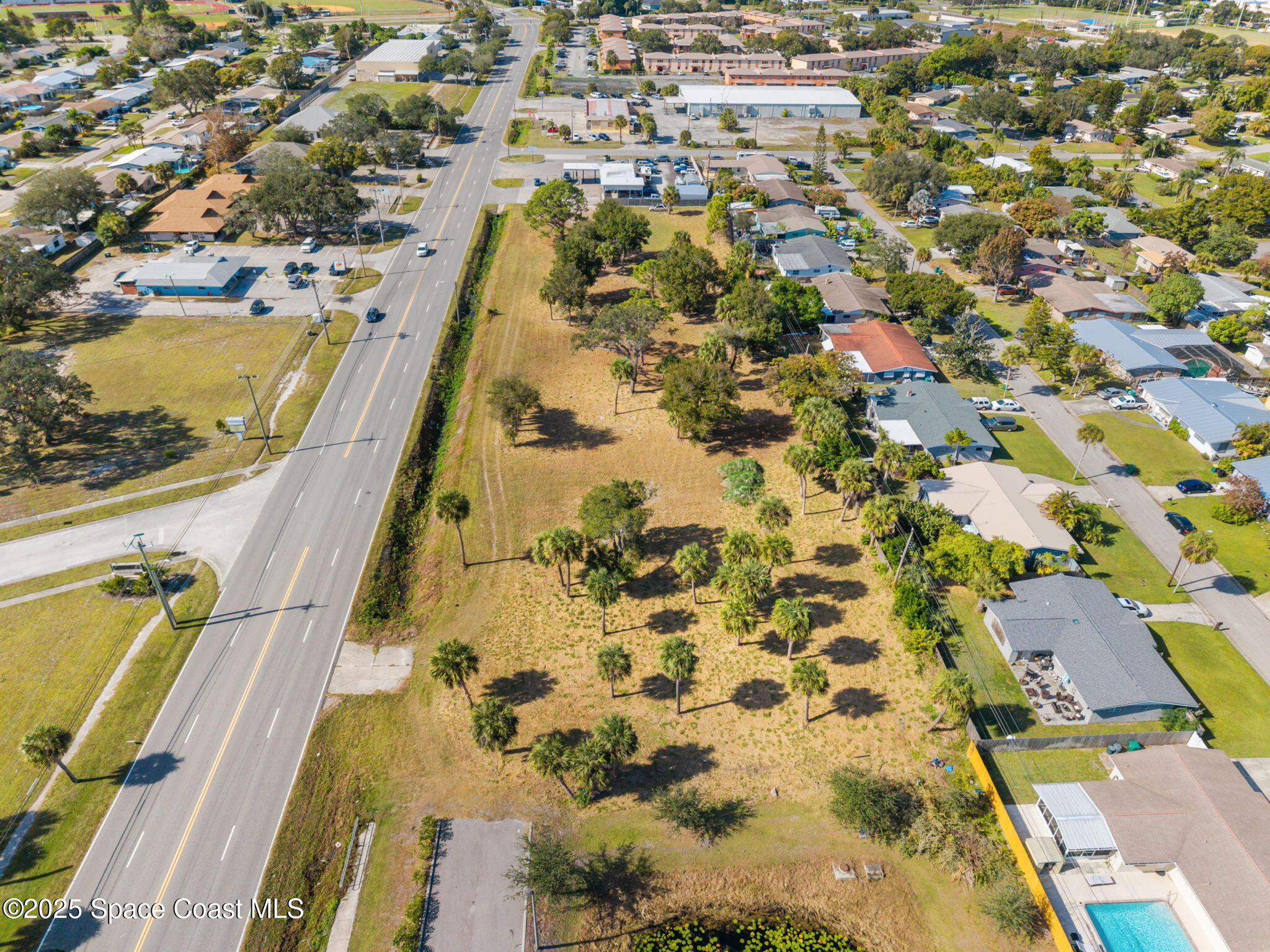 1400 Aurora Road Melbourne, FL 32935 - Photo 12 of 13 an aerial view of residential houses with yard