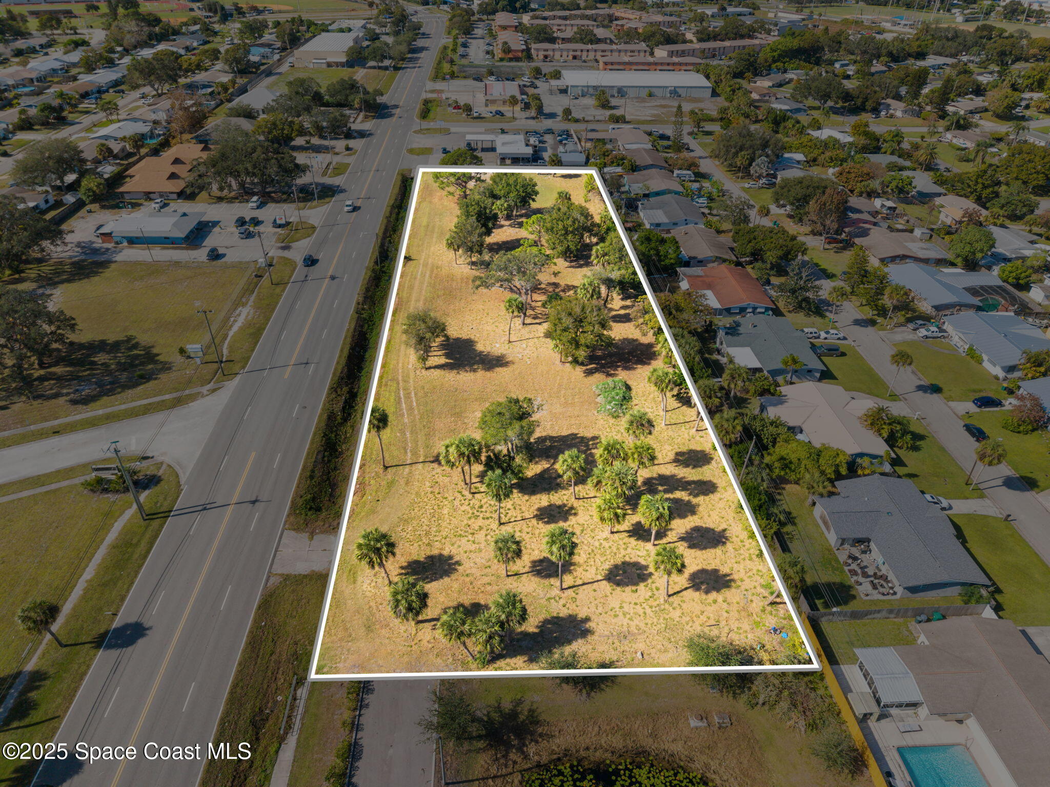 1400 Aurora Road Melbourne, FL 32935 - Photo 3 of 13 an aerial view of a yard