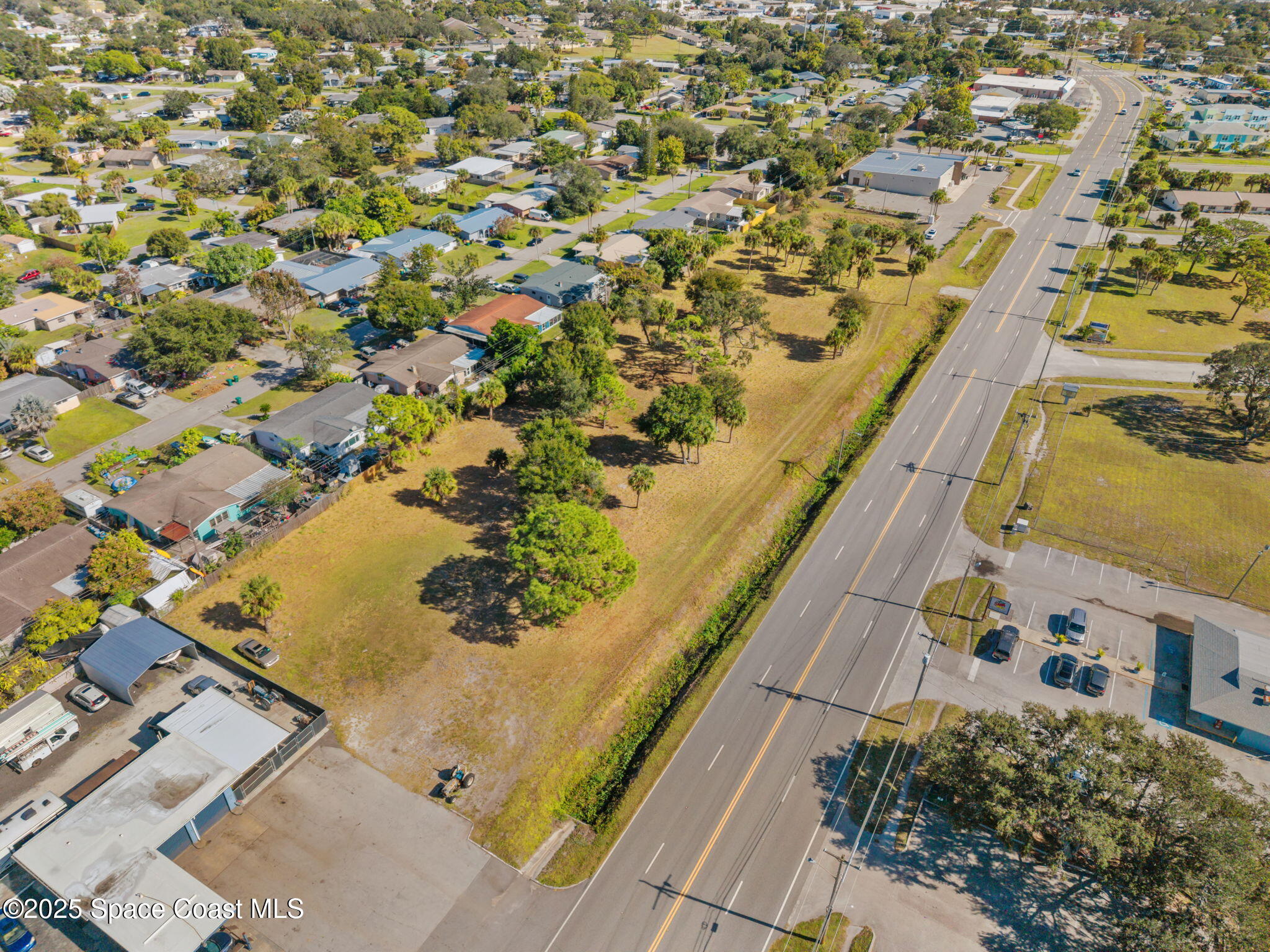 1400 Aurora Road Melbourne, FL 32935 - Photo 5 of 13 an aerial view of residential houses with outdoor space