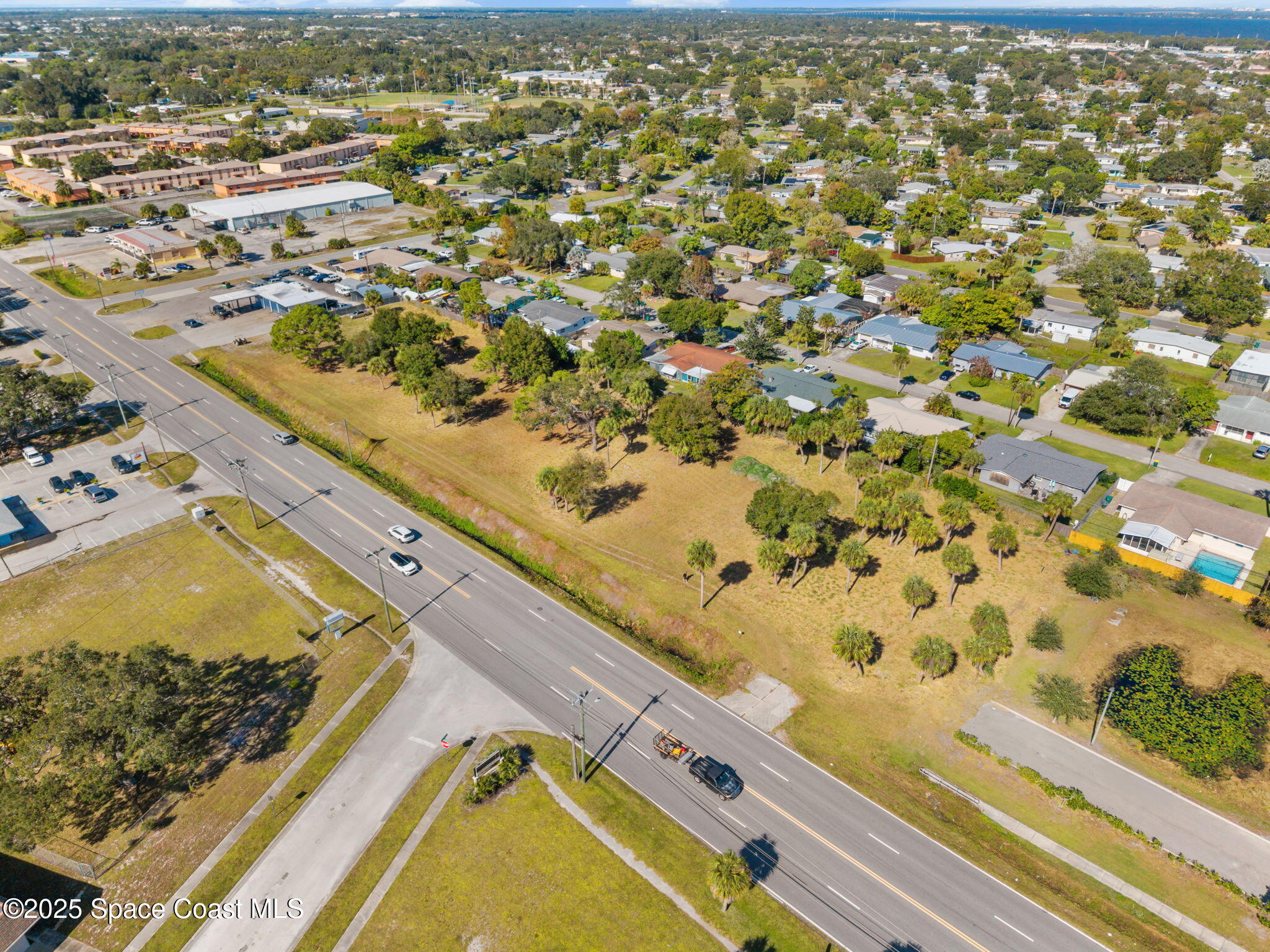 1400 Aurora Road Melbourne, FL 32935 - Photo 8 of 13 an aerial view of residential houses with outdoor space
