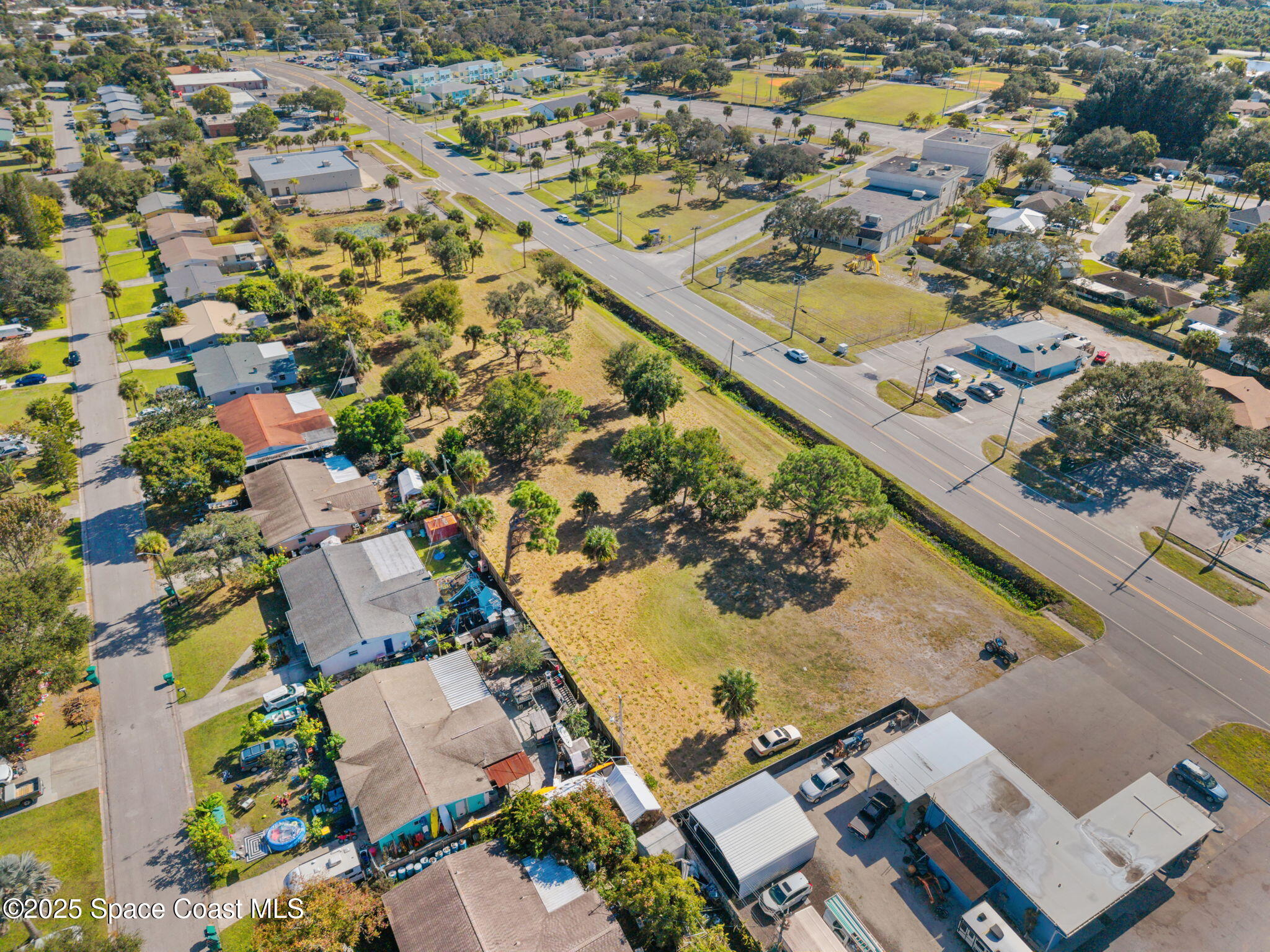 1400 Aurora Road Melbourne, FL 32935 - Photo 9 of 13 an aerial view of residential houses with outdoor space