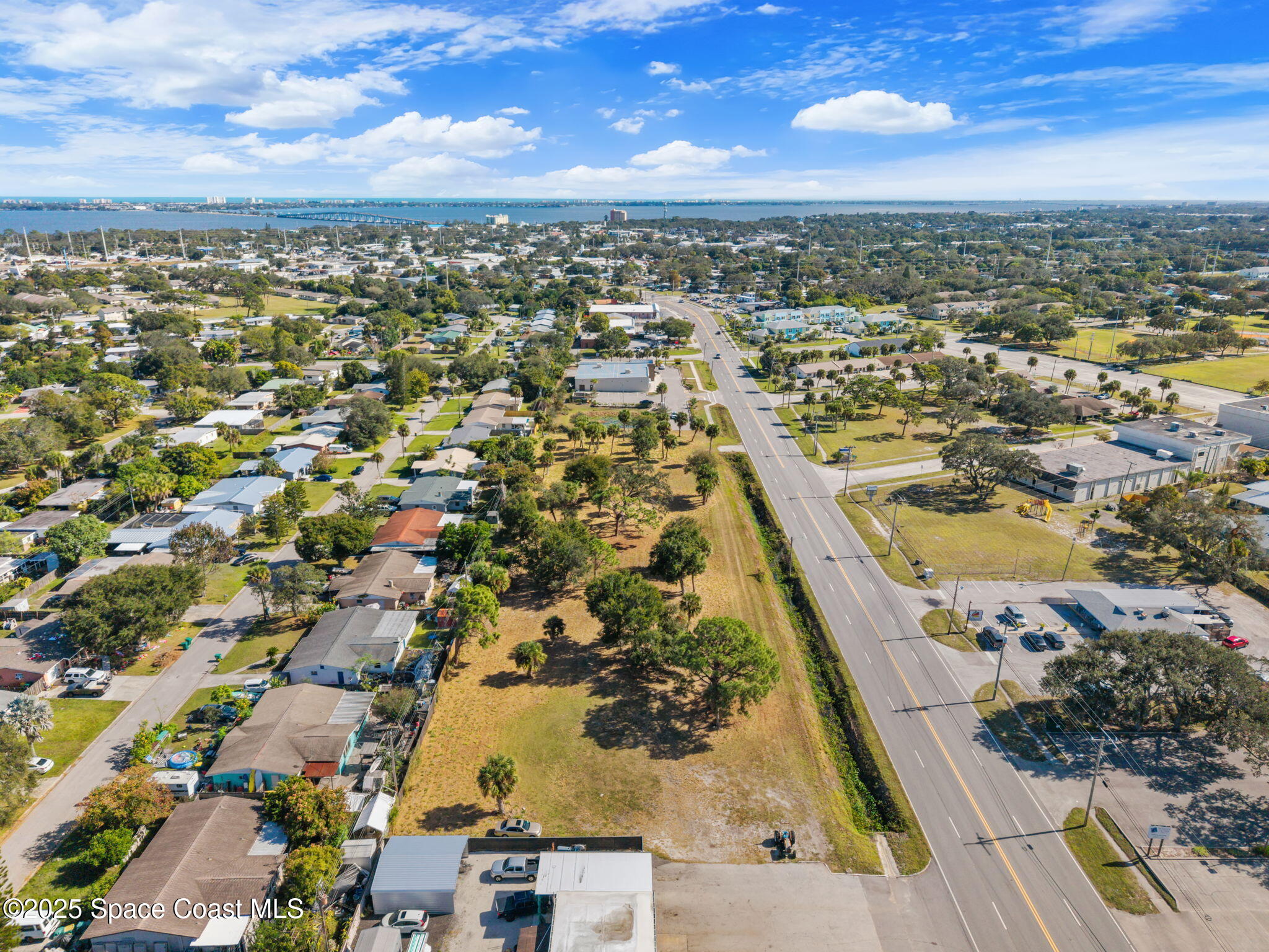 1400 Aurora Road Melbourne, FL 32935 - Photo 10 of 13 an aerial view of residential houses with outdoor space