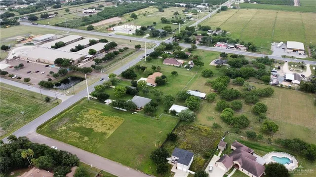 an aerial view of a residential houses with outdoor space