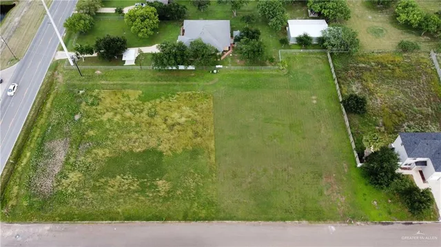 a view of a garden with a building