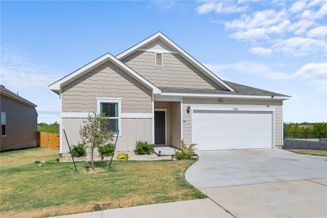 a front view of house with yard