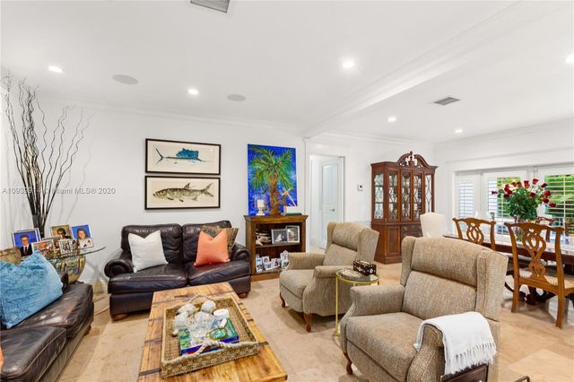 a view of a hallway with closet and a bathroom