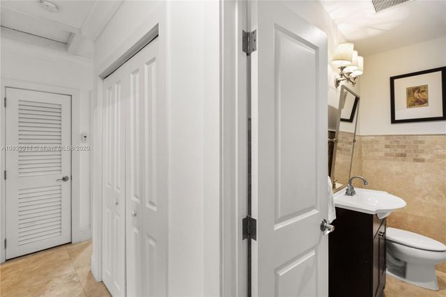a bedroom with furniture and a book shelf