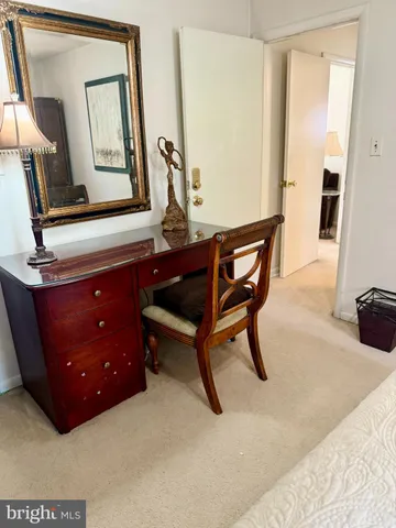 a room with furniture and mirror