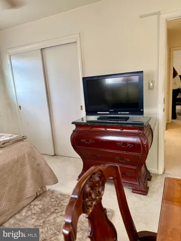 a room with furniture and a flat screen tv