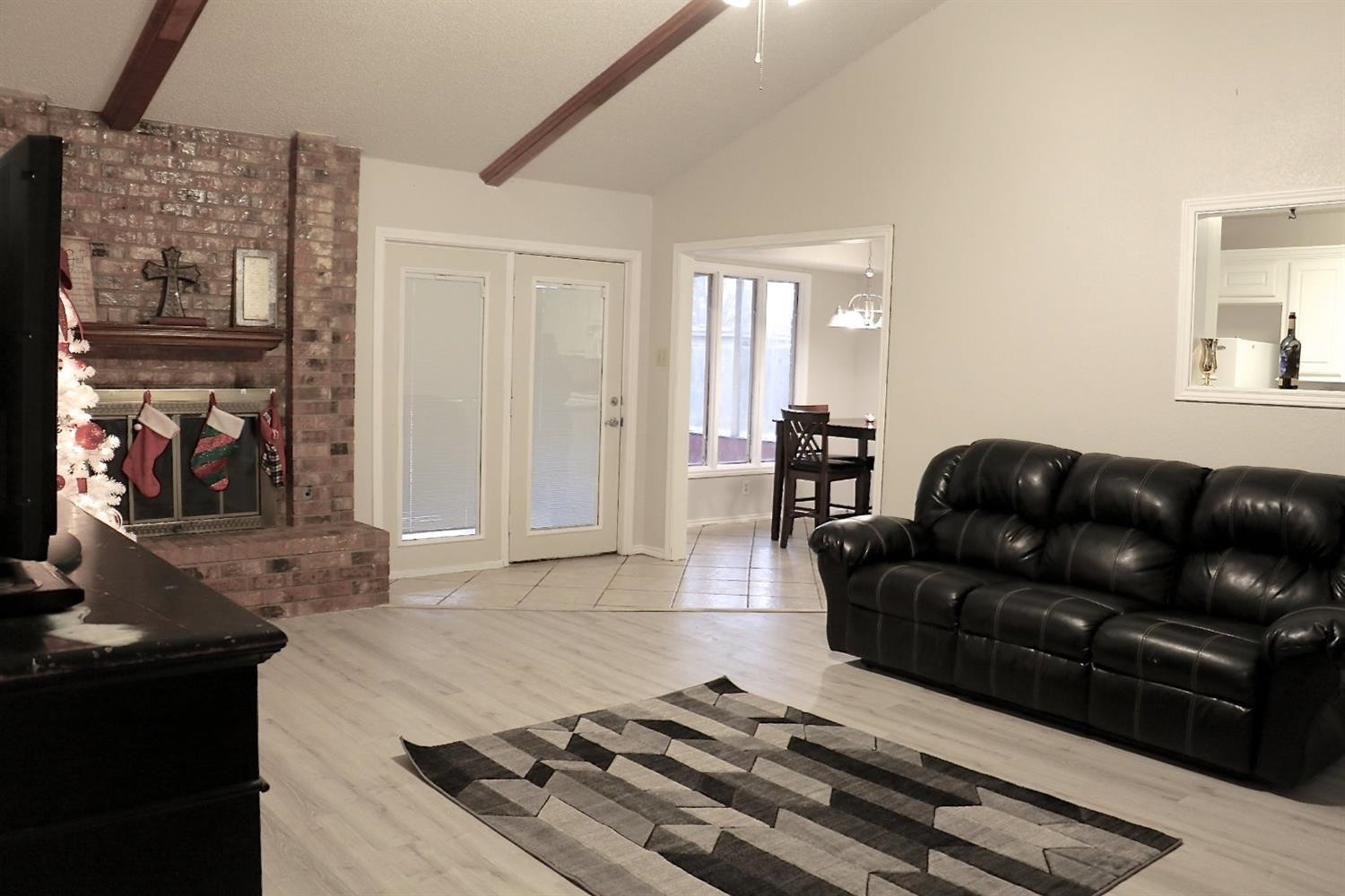 7004 Elkhart Avenue Lubbock, TX 79424 - Photo 22 of 44 a living room with furniture and a fireplace