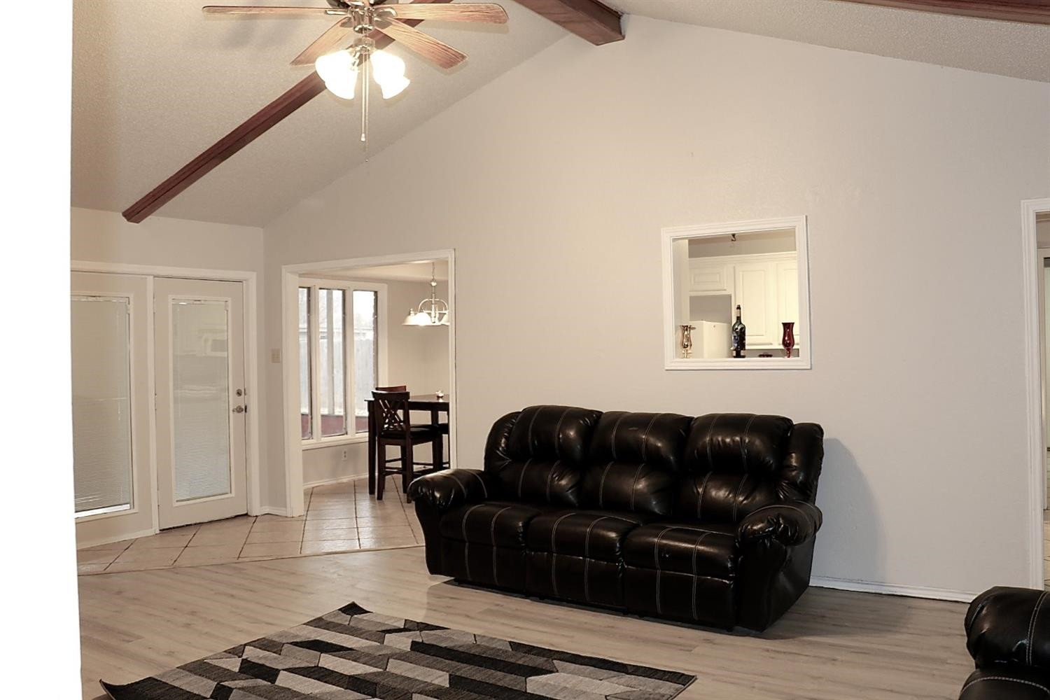 7004 Elkhart Avenue Lubbock, TX 79424 - Photo 32 of 44 a living room with furniture and wooden floor