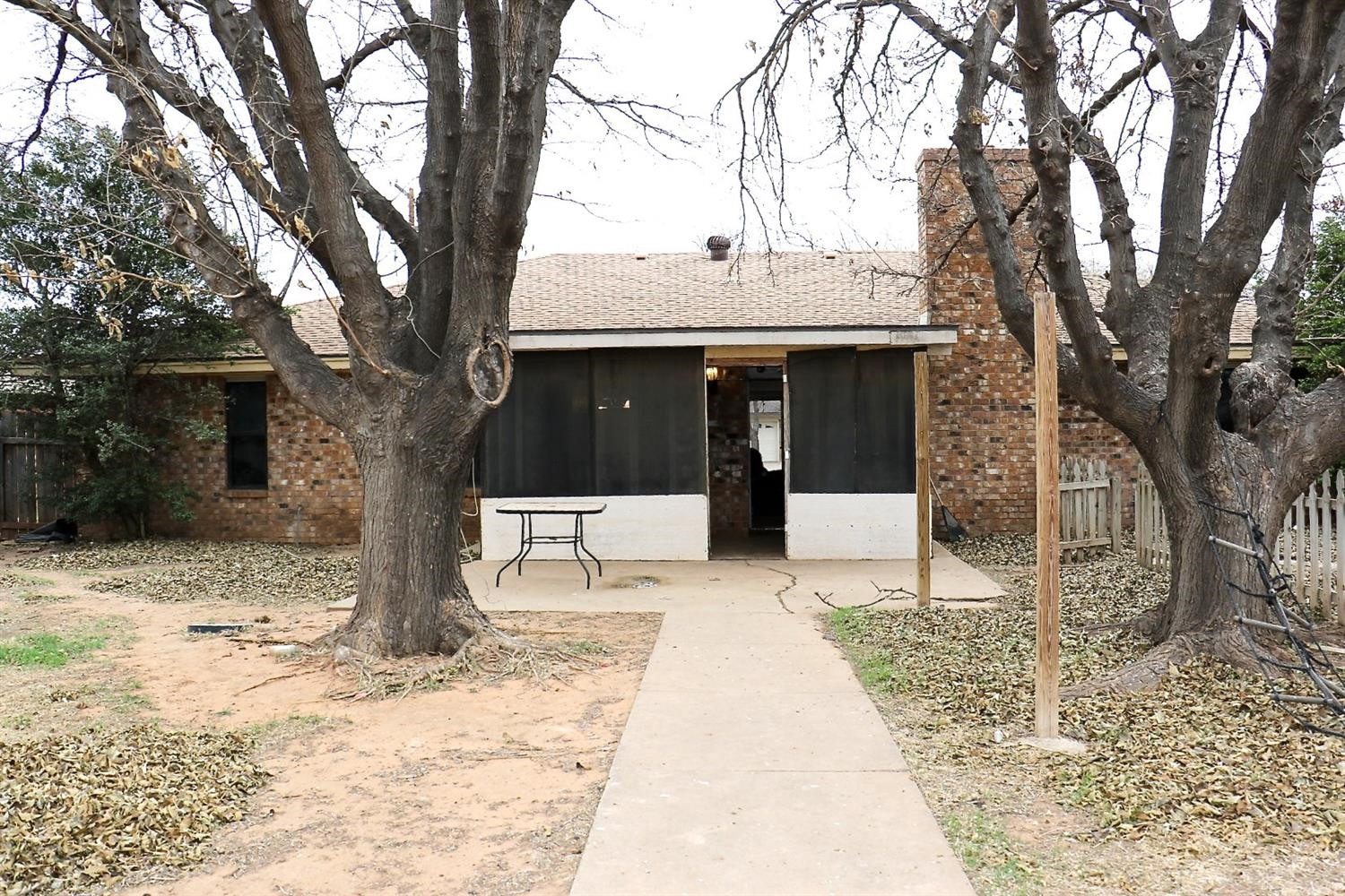 7004 Elkhart Avenue Lubbock, TX 79424 - Photo 36 of 44 a front view of a house with a yard