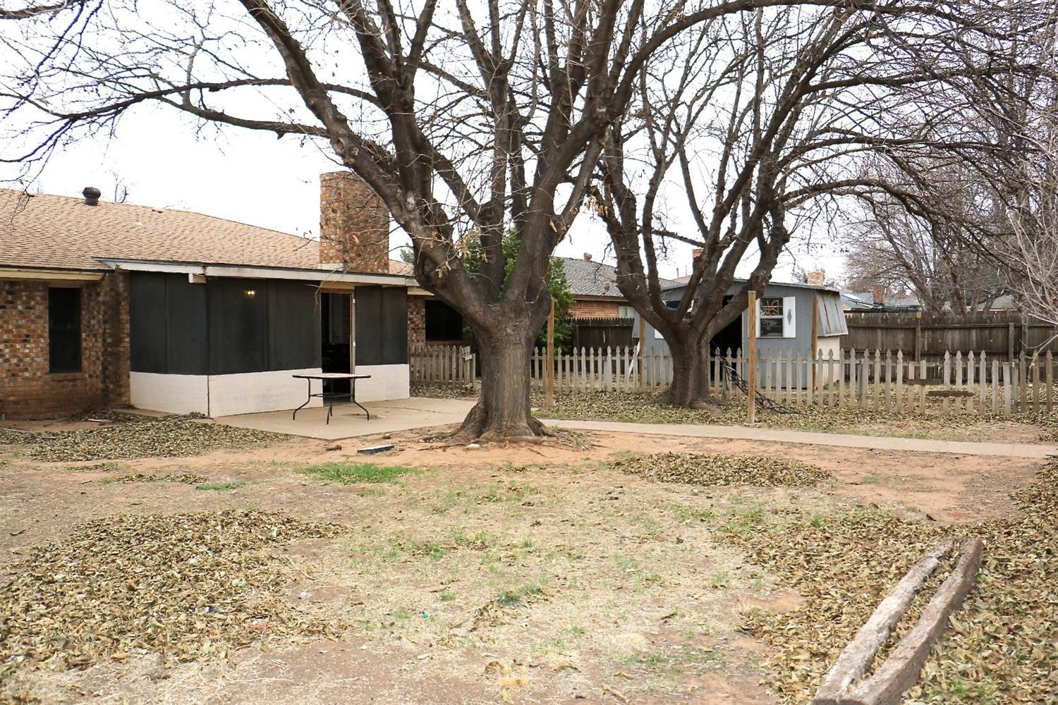 7004 Elkhart Avenue Lubbock, TX 79424 - Photo 38 of 44 a view of a house with a yard covered in snow