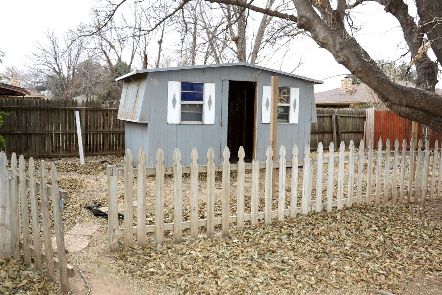 7004 Elkhart Avenue Lubbock, TX 79424 - Photo 39 of 44 a white house that has tree in front of it