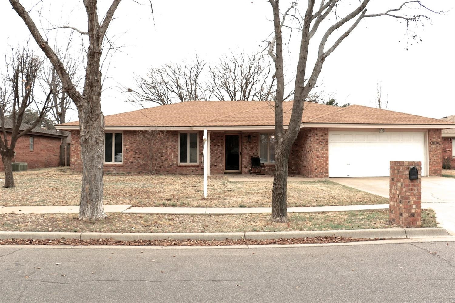 7004 Elkhart Avenue Lubbock, TX 79424 - Photo 42 of 44 a front view of a house with a tree