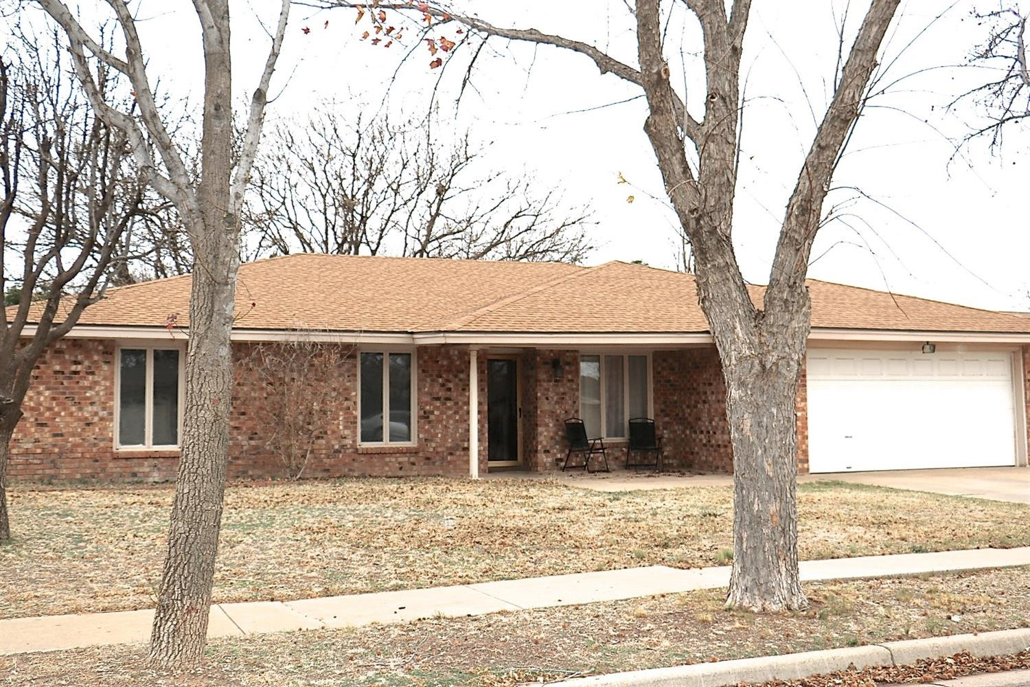 7004 Elkhart Avenue Lubbock, TX 79424 - Photo 43 of 44 front view of a house with a yard