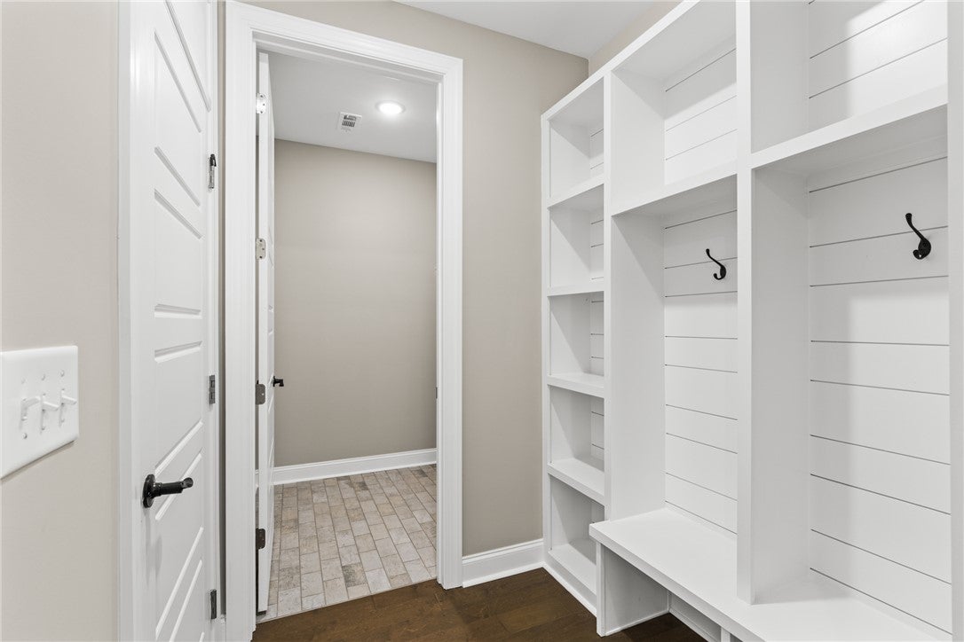 320 Coscoroba Road Auburn, AL 36832 - Photo 15 of 27 This mudroom offers practical storage solutions with built-in shelving and convenient hooks.