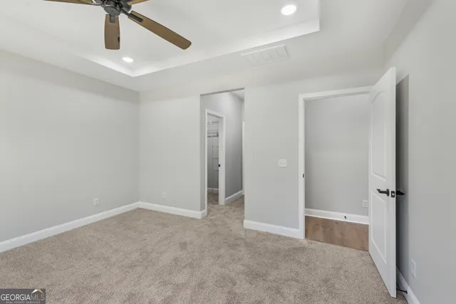 a bathroom with a granite countertop sink a mirror and a shower
