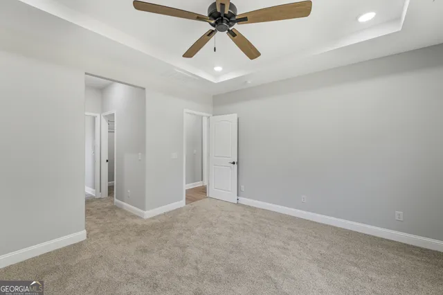 a bathroom with a granite countertop shower