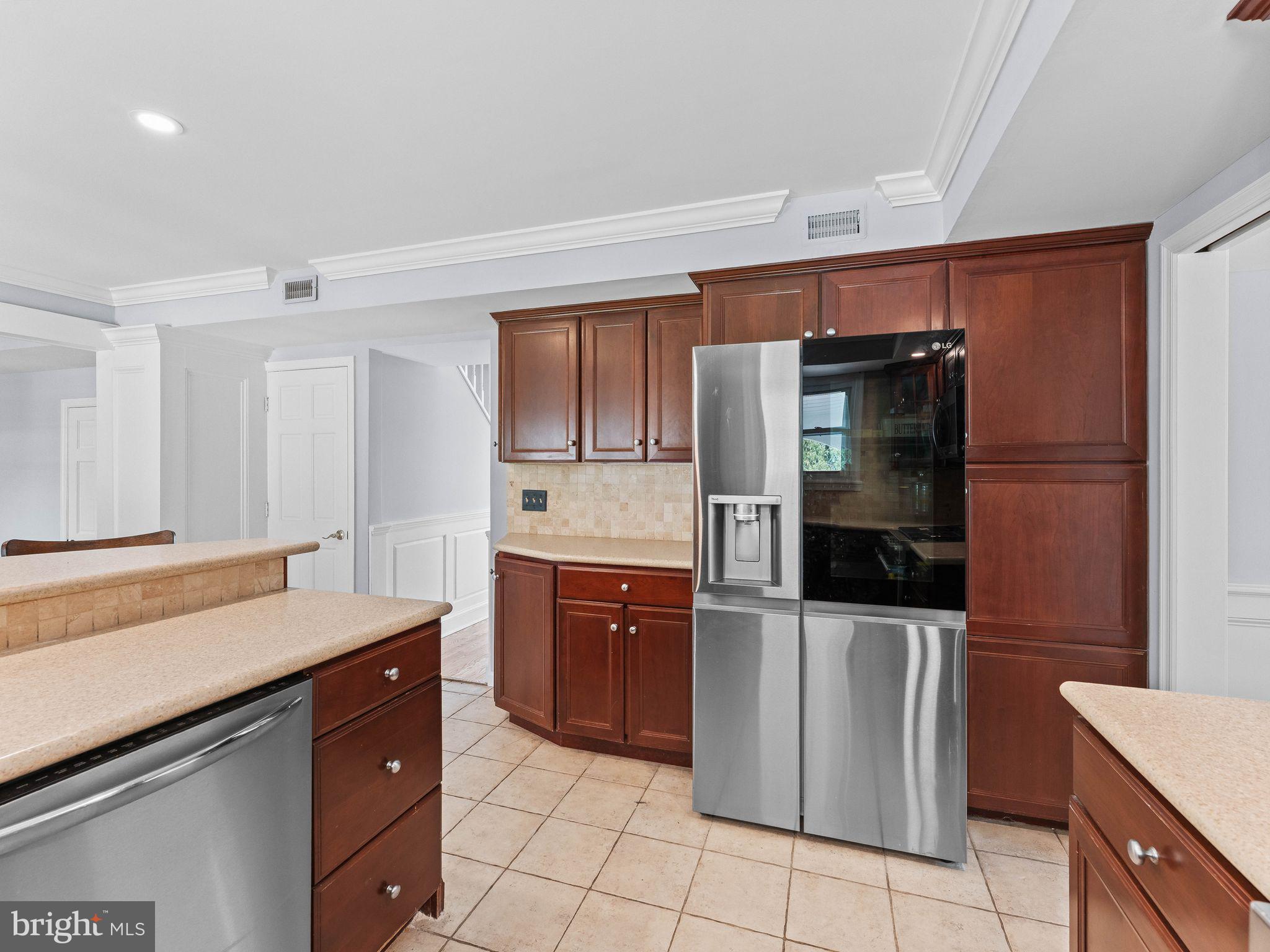 8 Chesterfield Road Sewell, NJ 08080 - Photo 14 of 57 a kitchen with stainless steel appliances a refrigerator and a stove