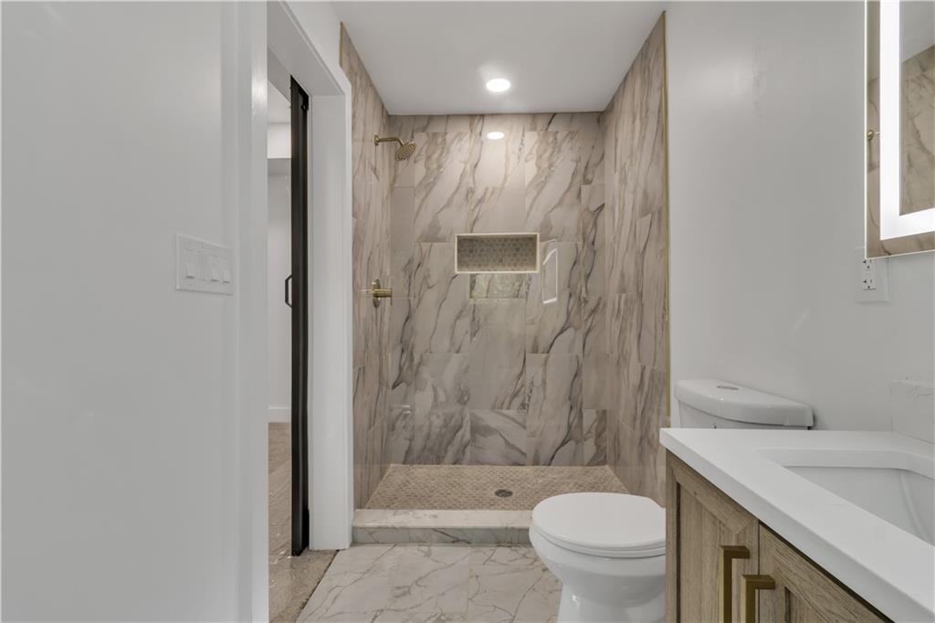 2358 Tilson Road Decatur, GA 30032 - Photo 9 of 14 a bathroom with a sink a toilet and shower