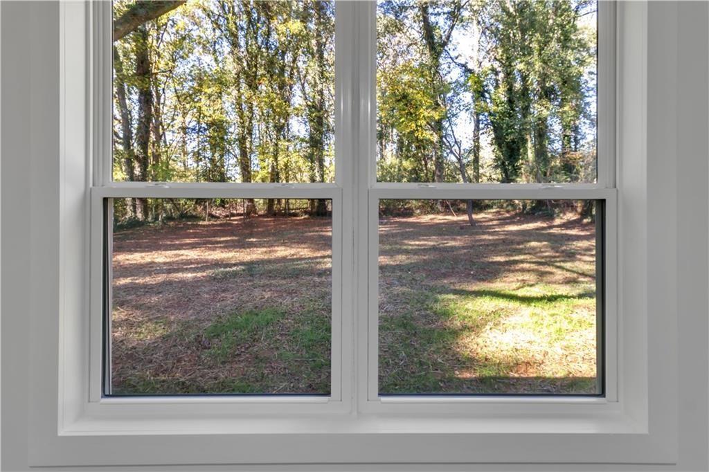 2358 Tilson Road Decatur, GA 30032 - Photo 10 of 14 a view of a window with a tree in front of it