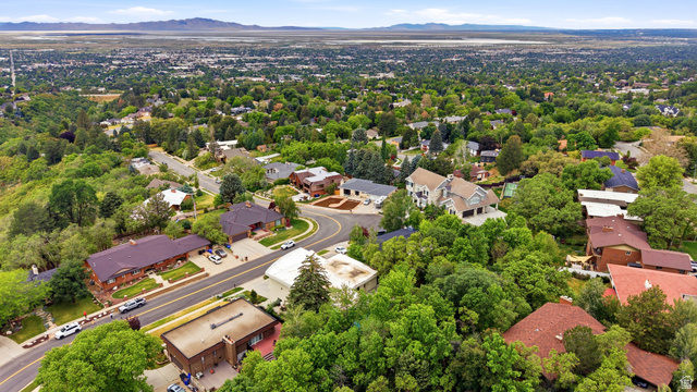 1389 Millbrook Way Bountiful, UT 84010 - Photo 73 of 74 Lush, tree-lined suburban landscape with a sweeping curve of residential streets