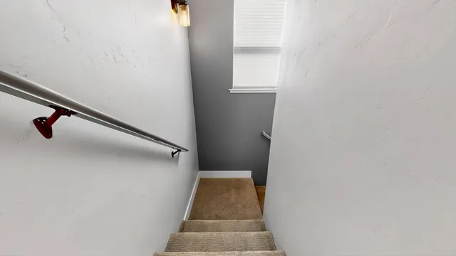 a view of staircase with white walls and a stairs