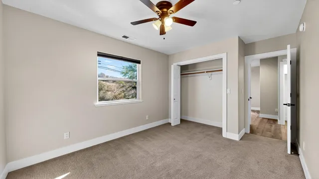 a bathroom with a toilet sink and shower