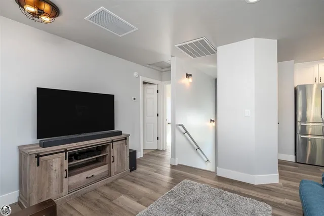 a view of a dining room with a table and chairs