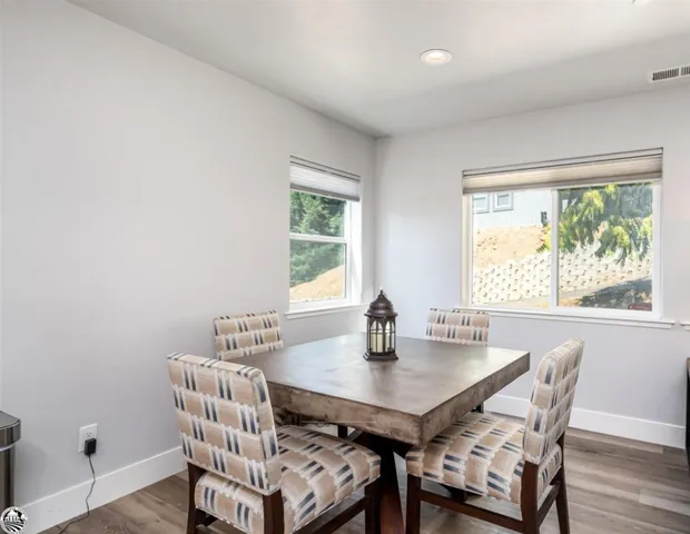 a bedroom with a bed closet and a flat tv screen