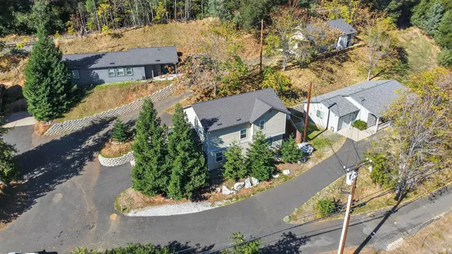 an aerial view of residential houses with outdoor space