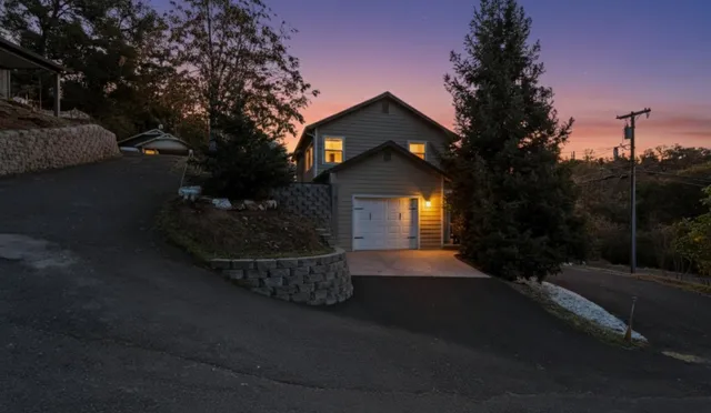 a bed sitting in a bedroom next to a white wall