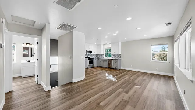 a view of kitchen and wooden floor